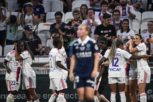 Lyon’s Malawian forward #22 Tabitha Chawinga (L) celebrates with his teamates after scoring a goal during the French women L1 football final match between OL Lyonnes and Paris FC at the Groupama stadium in Decines-Charpieu, central-eastern France, on May 29, 2026. (Photo by JEFF PACHOUD / AFP)