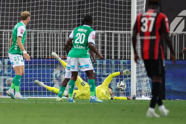 Saint-Etienne's French goalkeeper #30 Gautier Larsonneur fails to stop a goal during the L1-L2 playoff second-leg football match between first divison club OGC Nice and second division club AS Saint-Etienne at the Allianz Riviera Stadium in Nice, south-eastern France, on May 29, 2026. (Photo by Valery HACHE / AFP)