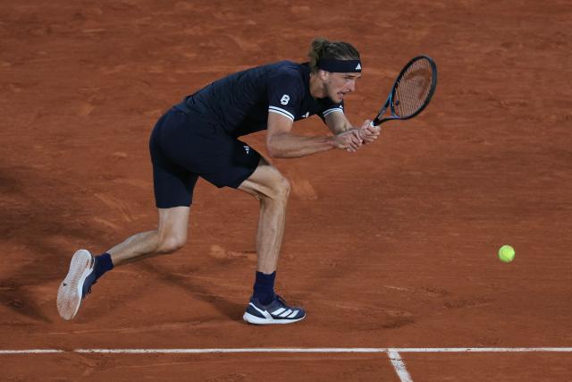 Germany's Alexander Zverev plays a backhand return to France's Quentin Halys during their men's singles match on day 6 of the French Open tennis tournament on Court Philippe-Chatrier at the Roland-Garros Complex in Paris on May 29, 2026. (Photo by Thomas SAMSON / AFP)