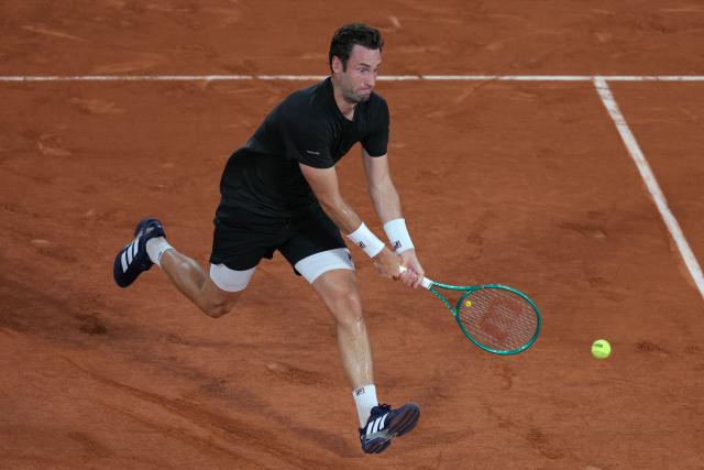 France's Quentin Halys plays a backhand return to Germany's Alexander Zverev during their men's singles match on day 6 of the French Open tennis tournament on Court Philippe-Chatrier at the Roland-Garros Complex in Paris on May 29, 2026. (Photo by Thomas SAMSON / AFP)