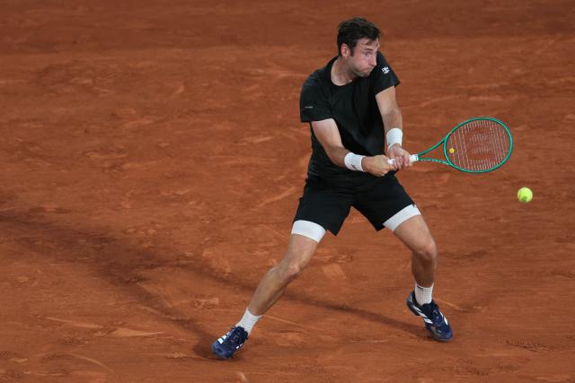 France's Quentin Halys plays a backhand return to Germany's Alexander Zverev during their men's singles match on day 6 of the French Open tennis tournament on Court Philippe-Chatrier at the Roland-Garros Complex in Paris on May 29, 2026. (Photo by Thomas SAMSON / AFP)