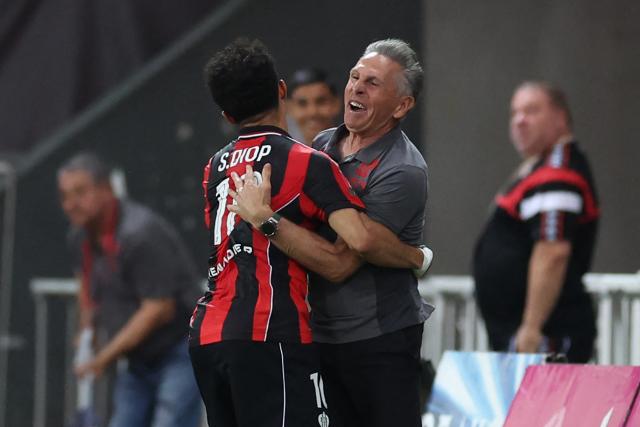 Nice's French head coach Claude Puel hugs Nice's Moroccan forward #10 Sofiane Diop as they celebrate after scoring a goal during the L1-L2 playoff second-leg football match between first divison club OGC Nice and second division club AS Saint-Etienne at the Allianz Riviera Stadium in Nice, south-eastern France, on May 29, 2026. (Photo by Valery HACHE / AFP)