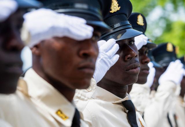 New members of Haiti's National Police salute while marching during their graduation ceremony at the Police Academy in Port-au-Prince, Haiti, on May 29, 2026. (Photo by Clarens SIFFROY / AFP)
