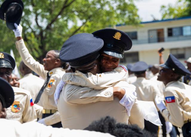 New members of Haiti's National Police celebrate at the end of their graduation ceremony at the Police Academy in Port-au-Prince, Haiti, on May 29, 2026. (Photo by Clarens SIFFROY / AFP)