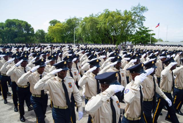 New members of Haiti's National Police salute while marching during their graduation ceremony at the Police Academy in Port-au-Prince, Haiti, on May 29, 2026. (Photo by Clarens SIFFROY / AFP)