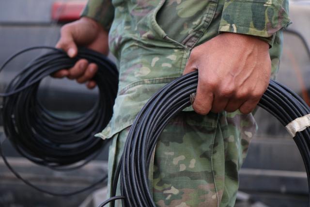 A member of the Army takes part in an operation against illegal mining in Buenos Aires, Imbabura province, Ecuador, on May 27, 2026. In Ecuador's rugged La Merced area, soldiers face substantial challenges from illegal gold miners and armed groups, including the Colombian Oliver Sinisterra Front and the Ecuadorian gang Los Lobos. Despite military operations supported by the U.S. to combat mining-related violence, the illegal mining sector continues to thrive, generating over $1.6 billion annually, surpassing drug trafficking revenues in some regions. Recent military efforts include air support and demolitions targeting illegal operations, as the country grapples with high homicide rates and ongoing criminal conflicts fueled by lucrative gold prices. (Photo by Galo Paguay / AFP)