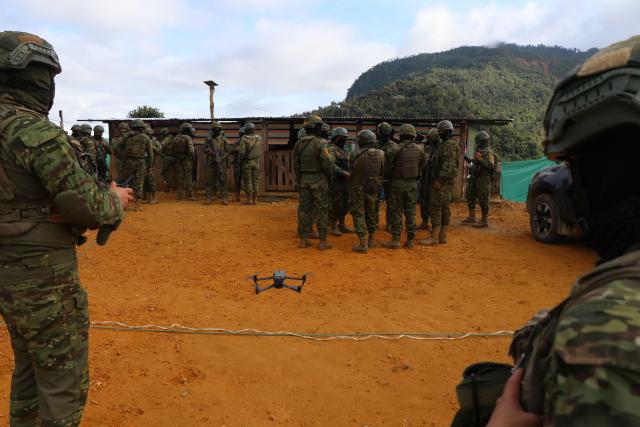 Members of the Army take part in an operation against illegal mining in Buenos Aires, Imbabura province, Ecuador, on May 27, 2026. In Ecuador's rugged La Merced area, soldiers face substantial challenges from illegal gold miners and armed groups, including the Colombian Oliver Sinisterra Front and the Ecuadorian gang Los Lobos. Despite military operations supported by the U.S. to combat mining-related violence, the illegal mining sector continues to thrive, generating over $1.6 billion annually, surpassing drug trafficking revenues in some regions. Recent military efforts include air support and demolitions targeting illegal operations, as the country grapples with high homicide rates and ongoing criminal conflicts fueled by lucrative gold prices. (Photo by Galo Paguay / AFP)
