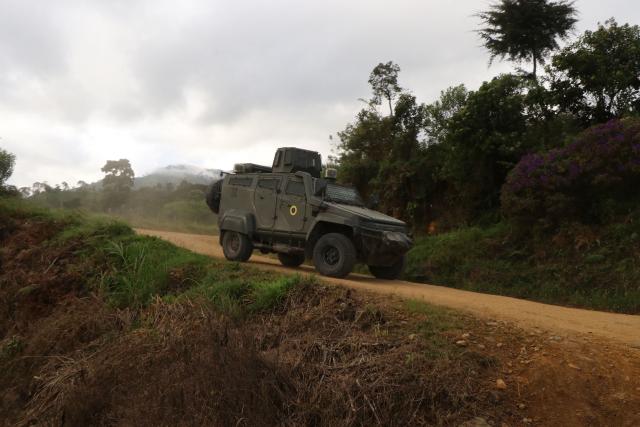 A military vehicle is seen during an operation against illegal mining in Buenos Aires, Imbabura province, Ecuador, on May 27, 2026. In Ecuador's rugged La Merced area, soldiers face substantial challenges from illegal gold miners and armed groups, including the Colombian Oliver Sinisterra Front and the Ecuadorian gang Los Lobos. Despite military operations supported by the U.S. to combat mining-related violence, the illegal mining sector continues to thrive, generating over $1.6 billion annually, surpassing drug trafficking revenues in some regions. Recent military efforts include air support and demolitions targeting illegal operations, as the country grapples with high homicide rates and ongoing criminal conflicts fueled by lucrative gold prices. (Photo by Galo Paguay / AFP)