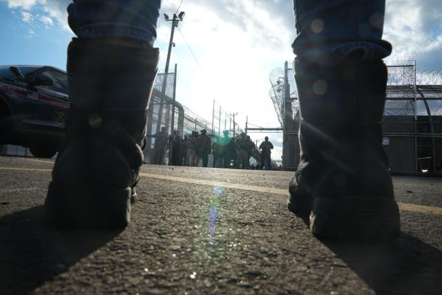 A protester stands outside the federal immigration center at Delaney Hall, which is being used as an Immigration and Customs Enforcement (ICE) detention center, in Newark, New Jersey, on May 29, 2026. Protesters clashed with US law enforcement outside an immigration detention center in New Jersey, a top US official said Friday, after inmates inside staged a hunger strike over conditions. Days of unrest outside the ICE detention center have led to several arrests as a tough stance by US President Donald Trump's administration draws stiff opposition. (Photo by Bryan R. SMITH / AFP)