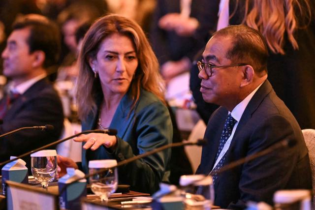 Netherlands' Deputy Prime Minister and Defence Minister Dilan Yesilgoz-Zegerius (L) and Malaysia's Defence Minister Mohamed Khaled Nordin attend a plenary session of the 23rd Shangri-La Dialogue summit in Singapore on May 30, 2026. (Photo by JAM STA ROSA / AFP)