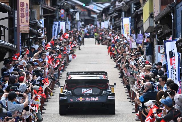 Sebastien Ogier of France and his co-drivrer Vincent Landais of France drive their their Toyota GR Yaris _Rally1 on the traditional Japanese townscape of Iwamura during the Rally Japan, the 7th round of the FIA World Rally Championships in Ena city, Gifu prefecture on May 30, 2026. (Photo by Toshifumi KITAMURA / AFP)