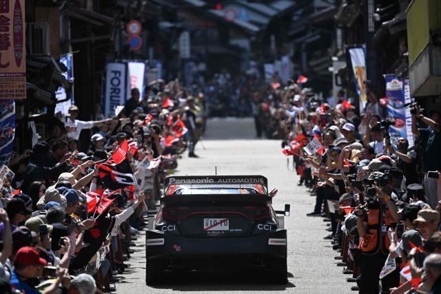 Elfyn Evans of Britain and his co-driver Scott Martin of Britain drive their Toyota GR Yaris Rally1 on the traditional Japanese townscape of Iwamura during the Rally Japan, the 7th round of the FIA World Rally Championships in Ena city, Gifu prefecture on May 30, 2026. (Photo by Toshifumi KITAMURA / AFP)