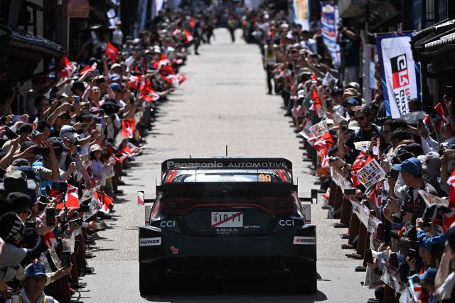 Oliver Solberg of Sweden and his co-driver Elliott Edmondson of Britain drive their their Toyota GR Yaris Rally1 on the traditional Japanese townscape of Iwamura during the Rally Japan, the 7th round of the FIA World Rally Championships in Ena city, Gifu prefecture on May 30, 2026. (Photo by Toshifumi KITAMURA / AFP)