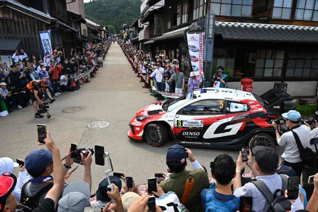 Sami Pajari of Finland and his co-driver Marko Salminen of Finland drive their Toyota GR Yaris Rally1 on the traditional Japanese townscape of Iwamura during the Rally Japan, the 7th round of the FIA World Rally Championships in Ena city, Gifu prefecture on May 30, 2026. (Photo by Toshifumi KITAMURA / AFP)
