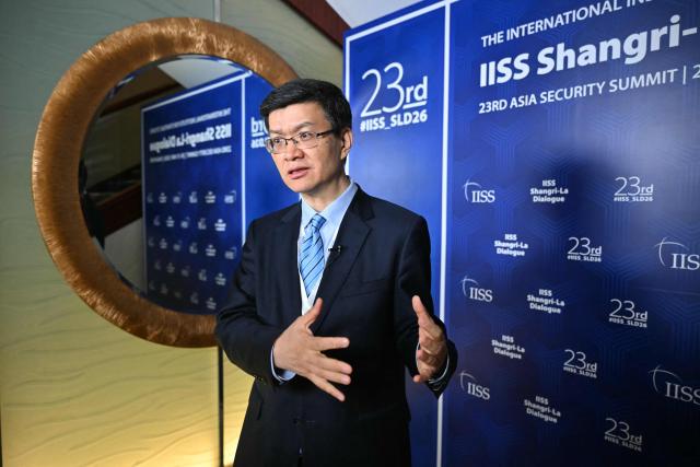 Da Wei, Director of the Centre for International Security and Strategy (CISS) at Beijing's Tsinghua University, speaks during a media interview on the sidelines of the 23rd Shangri-La Dialogue summit in Singapore on May 30, 2026. (Photo by MOHD RASFAN / AFP)