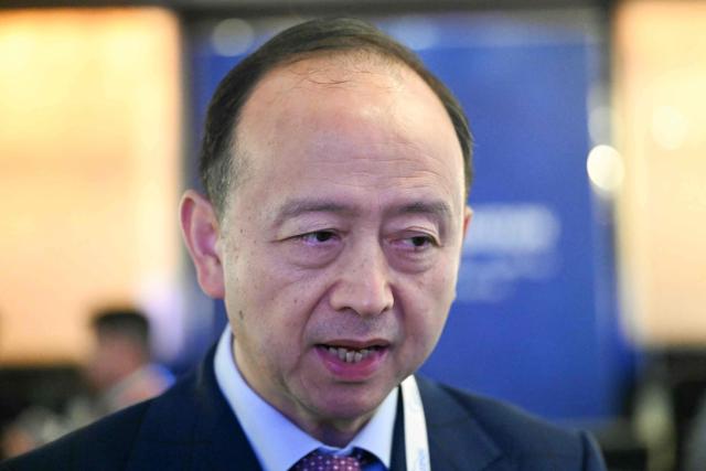 Zhou Bo, senior fellow of the Centre for International Security and Strategy (CISS) at Beijing's Tsinghua University, speaks during a media interview on the sidelines of the 23rd Shangri-La Dialogue summit in Singapore on May 30, 2026. (Photo by MOHD RASFAN / AFP)