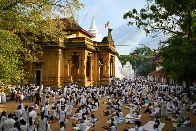 Devotees visit the Kelaniya Buddhist Temple to mark the 'Vesak festival' that commemorates the birth, the enlightenment, and the death of Buddha in Kelaniya on May 30, 2026. (Photo by Ishara S. KODIKARA / AFP)