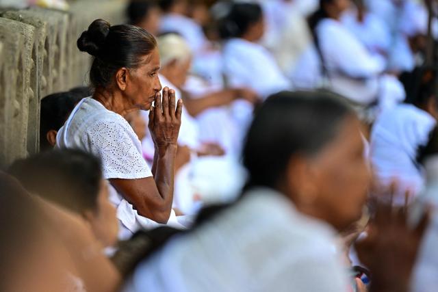 Devotees offer prayers at the Kelaniya Buddhist Temple to mark the 'Vesak festival' that commemorates the birth, the enlightenment, and the death of Buddha in Kelaniya on May 30, 2026. (Photo by Ishara S. KODIKARA / AFP)