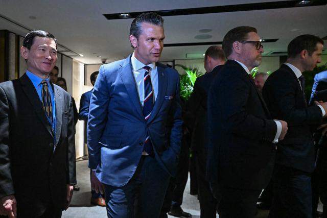 US Secretary of Defence Pete Hegseth (C) arrives for a ministerial roundtable during the 23rd Shangri-La Dialogue summit in Singapore on May 30, 2026. (Photo by MOHD RASFAN / AFP)