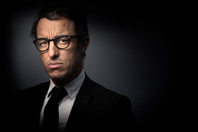 (FILES) French lawyer Karim Achoui poses in Paris on March 23, 2015. A Paris court will hold the deliberation on June 1, 2026, in the appeal trial of Karim Achoui over illegal practice of the profession of lawyer. (Photo by Joël SAGET / AFP)
