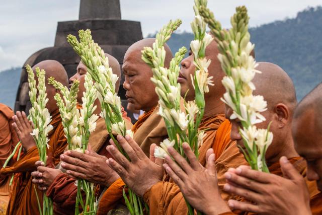 Multinational Buddhist monks pray toward the main stupa at Borobudur Temple, a 9th-century Buddhist monument and UNESCO World Heritage Site, in Magelang, Central Java, on May 30, 2026, as part of the Indonesia Walk of Peace (IWOP 2026), a 660-kilometre journey from Bali completed over 20 days ahead of the Vesak Day celebration. (Photo by DEVI RAHMAN / AFP)