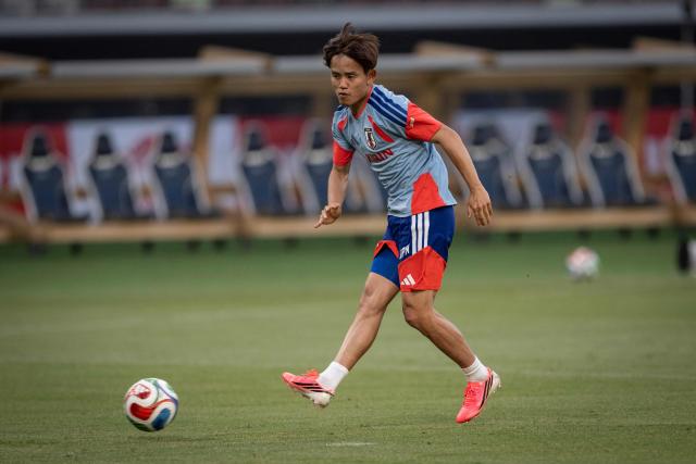 Japan's Takefusa Kubo (L) attends a practice session ahead of the May 31 international friendly match between Japan and Iceland, at the National Stadium in Tokyo on May 30, 2026. (Photo by Yuichi YAMAZAKI / AFP)