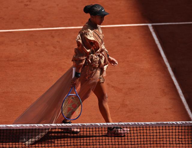 Japan's Naomi Osaka arrives on court for her women's singles match against US Iva Jovic on day 7 of the French Open tennis tournament on Court Suzanne-Lenglen at the Roland-Garros Complex in Paris on May 30, 2026. (Photo by Anne-Christine POUJOULAT / AFP)