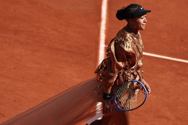 Japan's Naomi Osaka arrives on court for her women's singles match against US Iva Jovic on day 7 of the French Open tennis tournament on Court Suzanne-Lenglen at the Roland-Garros Complex in Paris on May 30, 2026. (Photo by Anne-Christine POUJOULAT / AFP)