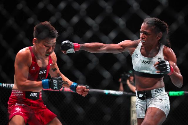 US strawweight fighter Angela Hill (R) punches China’s Xiong Jingnan during their bout at UFC Fight Night at the Galaxy hotel resort in Macau on May 30, 2026. (Photo by Eduardo Leal / AFP)