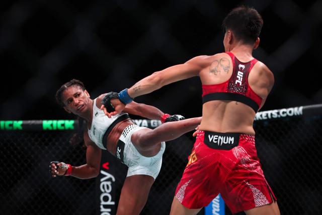 US strawweight fighter Angela Hill (L) kicks China’s Xiong Jingnan during their bout at UFC Fight Night at the Galaxy hotel resort in Macau on May 30, 2026. (Photo by Eduardo Leal / AFP)