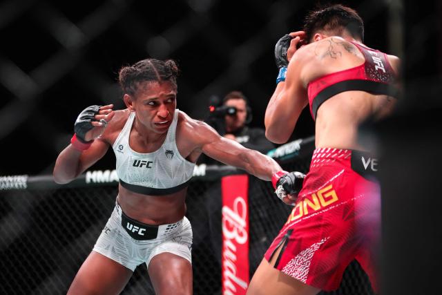 US strawweight fighter Angela Hill (L) punches China’s Xiong Jingnan during their bout at UFC Fight Night at the Galaxy hotel resort in Macau on May 30, 2026. (Photo by Eduardo Leal / AFP)