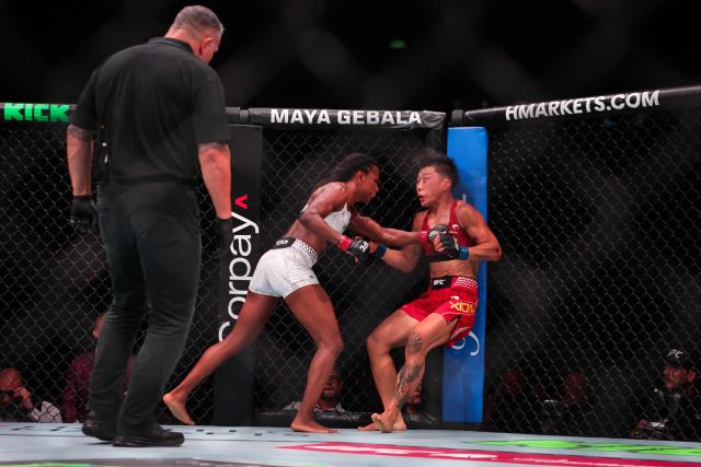 US strawweight fighter Angela Hill (L) punches China’s Xiong Jingnan during their bout at UFC Fight Night at the Galaxy hotel resort in Macau on May 30, 2026. (Photo by Eduardo Leal / AFP)