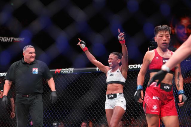 US strawweight fighter Angela Hill (C) celebrates her victory against China’s Xiong Jingnan at UFC Fight Night at the Galaxy hotel resort in Macau on May 30, 2026. (Photo by Eduardo Leal / AFP)
