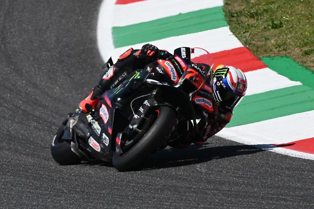 Aprilia Racing team's Italian MotoGP rider Marco Bezzecchi takes part in the Qualifying session for the Italian Moto GP Grand Prix at Mugello circuit, in Mugello, near Florence, on May 30, 2026. (Photo by Andreas SOLARO / AFP)