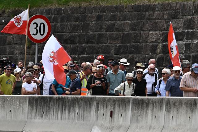 People take part in a demonstration against transit traffic near the A13 Brenner Highway in the direction of Italy on May 30, 2026, on the Tyrolean Brenner Highway. A protest in Austria on May 30 against noise and pollution is set to close one of Europe's most important highways connecting Germany and Italy, potentially causing major traffic disruptions.
Communities in Austria's western Tyrol province have long complained about traffic, especially trucks passing over the Brenner Pass and through the province. (Photo by Joe Klamar / AFP)