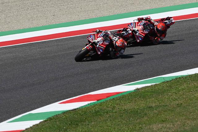 Ducati Lenovo Team's Italian MotoGP rider Francesco Bagnaia (L) and Ducati Lenovo Team's Spanish MotoGP rider Marc Marquez take part in the Qualifying session for the Italian Moto GP Grand Prix at Mugello circuit, in Mugello, near Florence, on May 30, 2026. (Photo by Andreas SOLARO / AFP)