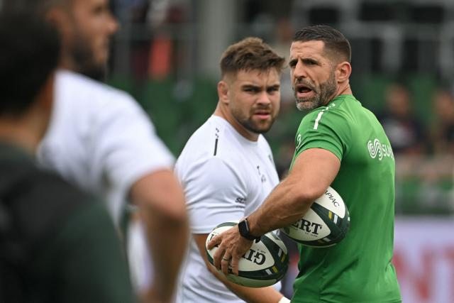 Montauban's French head coach Sebastien Tillous-Borde (R) speaks during warm-up ahead of the French Top14 rugby union match between US Montauban and Stade Rochelais (La Rochelle) at Stade Sapiac in Montauban, south-western France on May 30, 2026. (Photo by Matthieu RONDEL / AFP)