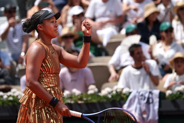 Japan's Naomi Osaka celebrates her victory at the end of her women's singles match against US Iva Jovic on day 7 of the French Open tennis tournament on Court Suzanne-Lenglen at the Roland-Garros Complex in Paris on May 30, 2026. (Photo by Anne-Christine POUJOULAT / AFP)