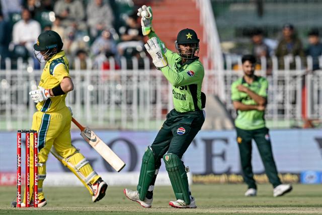 Pakistan's wicketkeeper Ghazi Ghori (C) fields the ball during the first one-day international (ODI) cricket match between Pakistan and Australia at the Rawalpindi Cricket Stadium in Rawalpindi on May 30, 2026. (Photo by Aamir QURESHI / AFP)