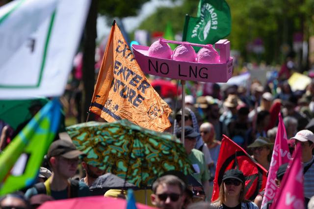 People take part in a demonstration under the motto "Future instead of gas – Together for the energy transition" organized by environmental organizations BUND, Campact, Fridays For Future, and Greenpeace against the German government's energy policy, on May 30, 2026 in Hamm, western Germany. (Photo by Pau BARRENA / AFP)