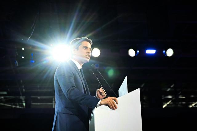 General Secretary of French centrist party Renaissance and candidate for France's 2027 Presidential election Gabriel Attal delivers a speech on stage during a political meeting, in Paris, on May 30, 2026. (Photo by LOU BENOIST / AFP)