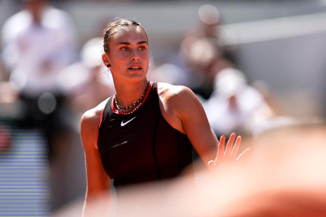 Aryna Sabalenka reacts to a point against Australia's Daria Kasatkina during their women's singles match on day 7 of the French Open tennis tournament on Court Suzanne-Lenglen at the Roland-Garros Complex in Paris on May 30, 2026. (Photo by Anne-Christine POUJOULAT / AFP)