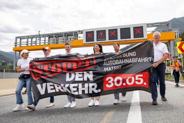 People demonstrate with a banner reading 'Stop traffic' against transit traffic near the A13 Brenner Highway in the direction of Italy during the blockade of the Brenner Base Tunnel on May 30, 2026, on the Tyrolean Brenner Highway. A protest in Austria on May 30 against noise and pollution is set to close one of Europe's most important highways connecting Germany and Italy, potentially causing major traffic disruptions.
Communities in Austria's western Tyrol province have long complained about traffic, especially trucks passing over the Brenner Pass and through the province. (Photo by EXPA/ JOHANN GRODER / APA / AFP) / Austria OUT