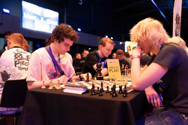 Visitors play chess during the gaming convention for the livestreaming video platform Twitch, TwitchCon Europe, in Ahoy in Rotterdam on May 30, 2026. (Photo by Lina SELG / AFP)