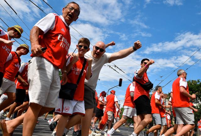 Arsenal supporters cheer as they march towards the stadium in Budapest on May 30, 2026, before the UEFA Champions League final football match to be played between Paris Saint-Germain (PSG) and Arsenal FC in the Hungarian capital. (Photo by Ferenc ISZA / AFP)