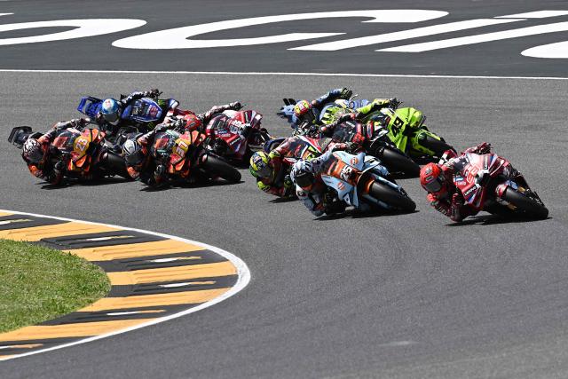 Ducati Lenovo Team's Spanish MotoGP rider Marc Marquez (R) takes part in the sprint on the eve of the Italian Moto GP Grand Prix at Mugello circuit, in Mugello, near Florence, on May 30, 2026. (Photo by Andreas SOLARO / AFP)
