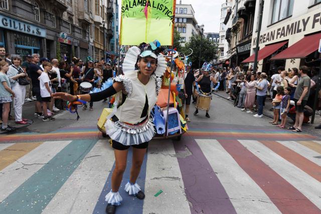 Participants take part in the 14th edition of the 'Zinneke Parade' in Brussels on May 30, 2026. The multicultural carnival and community-led parade weaves through Brussels with towering costumes, street theatre and live music — created in 2000 by artists and neighbourhood collectives, celebrating the city's cultural mix in a joyful, irreverent procession held every two years. (Photo by NICOLAS MAETERLINCK / Belga / AFP) / Belgium OUT