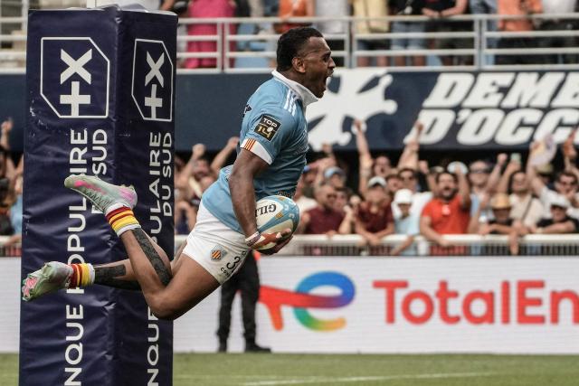 Perpignan’s Fijian centre Alivereti Duguivalu scores a try during the French Top14 rugby union match between USA Perpignan and Castres Olympique at the Aime-Giral stadium in Perpignan, south-western France on May 30, 2026. (Photo by Idriss Bigou-Gilles / AFP) / ALTERNATE CROP