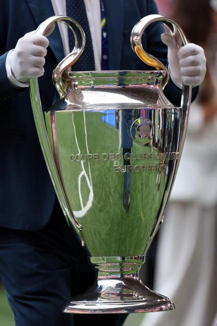 The trophy is carried into the stadium before the UEFA Champions League final football match between Paris Saint-Germain (PSG) and Arsenal FC at the Puskas Arena in Budapest on May 30, 2026. (Photo by Odd ANDERSEN / AFP)