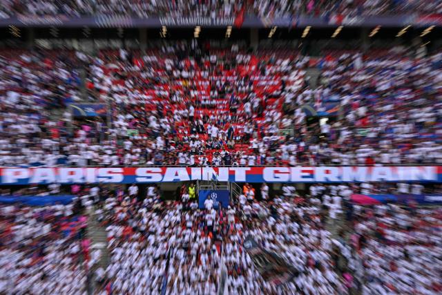 PSG fans are seen on the stands prior to the UEFA Champions League final football match between Paris Saint-Germain (PSG) and Arsenal FC at the Puskas Arena in Budapest on May 30, 2026. (Photo by NICOLAS TUCAT / AFP)